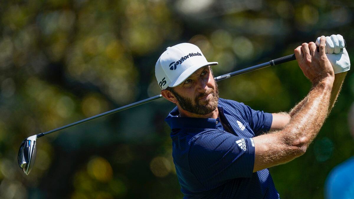 Dustin Johnson hits his tee shot on the fifth hole during the final round of the Tour...