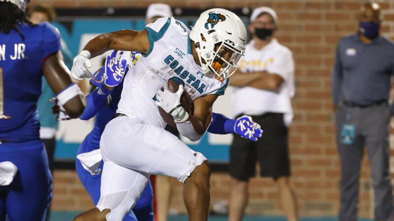 Coastal Carolina running back Reese White runs for a touchdown against Kansas during the...