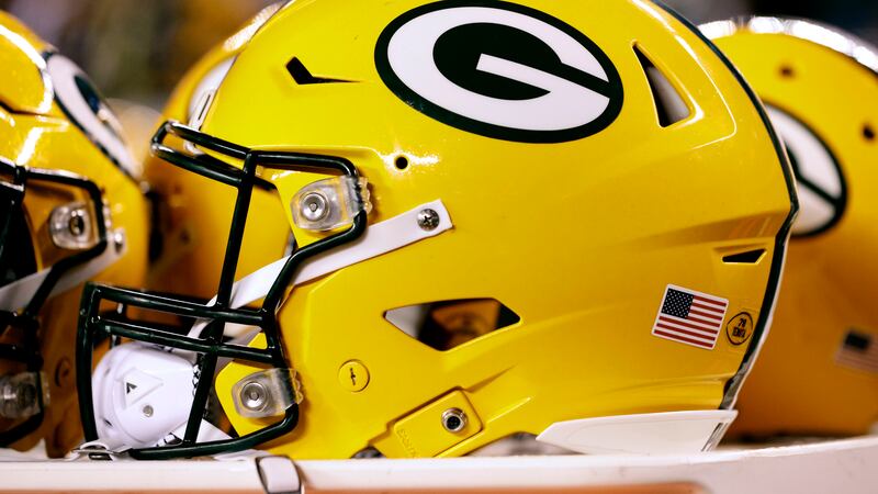A Green Bay Packers helmet sits on the sidelines during an NFL football game against the...