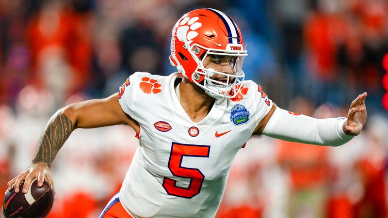 Clemson quarterback DJ Uiagalelei (5) runs with the ball against North Carolina during the...