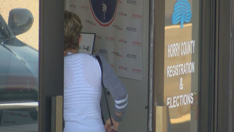 People enter the Horry County Registration and Elections office during absentee voting....