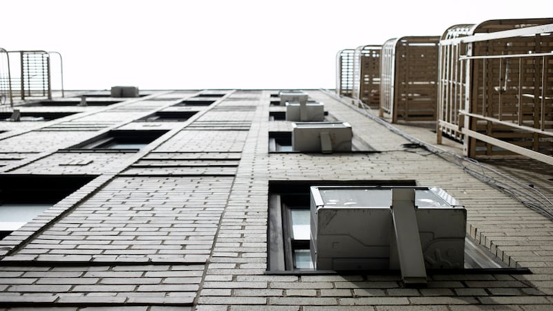 FILE - Window air conditioning units sit in windows in New York. In a major action to address...