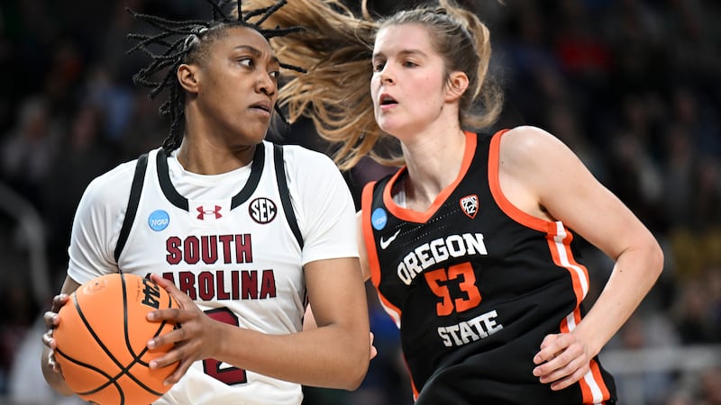 South Carolina forward Ashlyn Watkins (2) drives against Oregon State forward Kelsey Rees (53)...