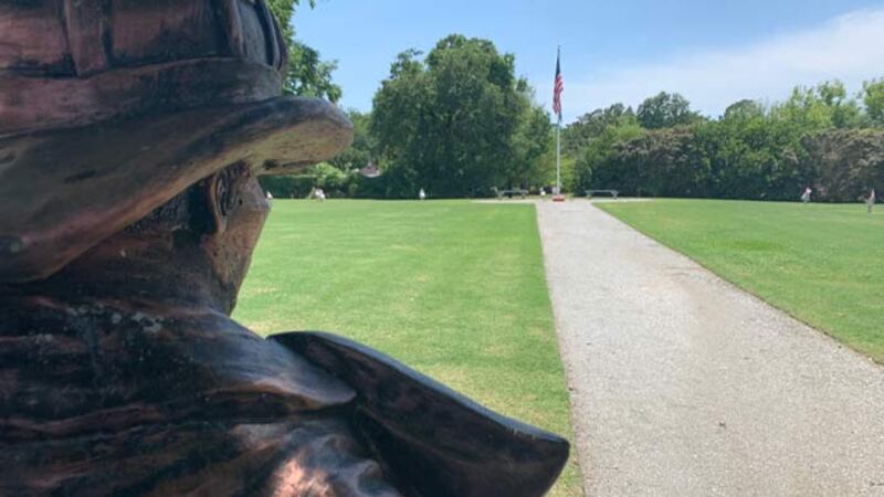 A firefighter statue watches over the Charleston 9 Memorial Park in West Ashley.