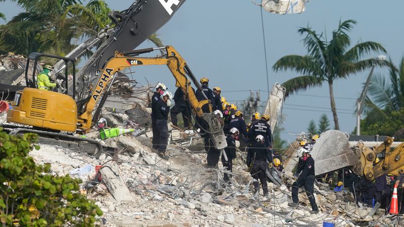 FILE - Rescue crews work at the site of the collapsed Champlain Towers South condo building...