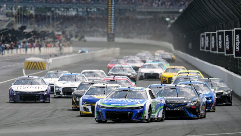 Daniel Suarez leads the field for the start of a NASCAR Cup Series auto race at Indianapolis...