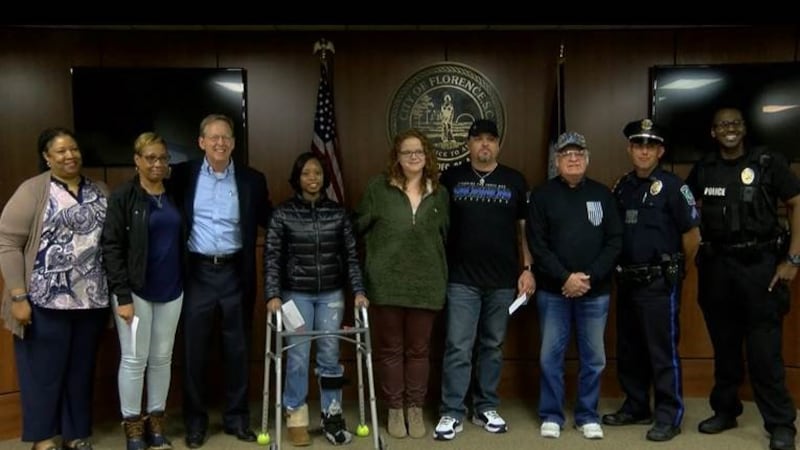 Florence police officers and families impacted by the deadly October ambush received donations...