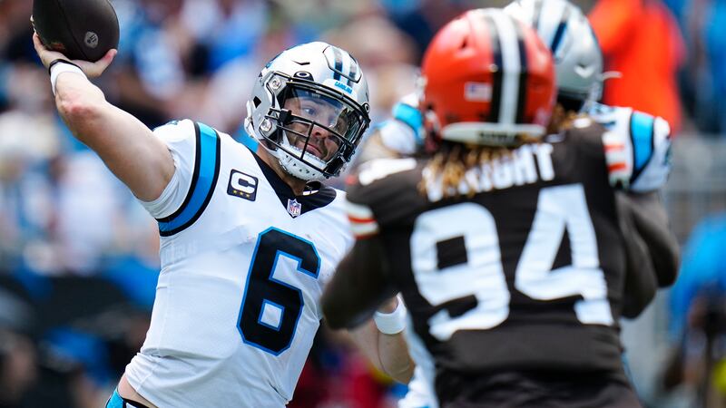 Carolina Panthers quarterback Baker Mayfield passes against the Cleveland Browns during the...