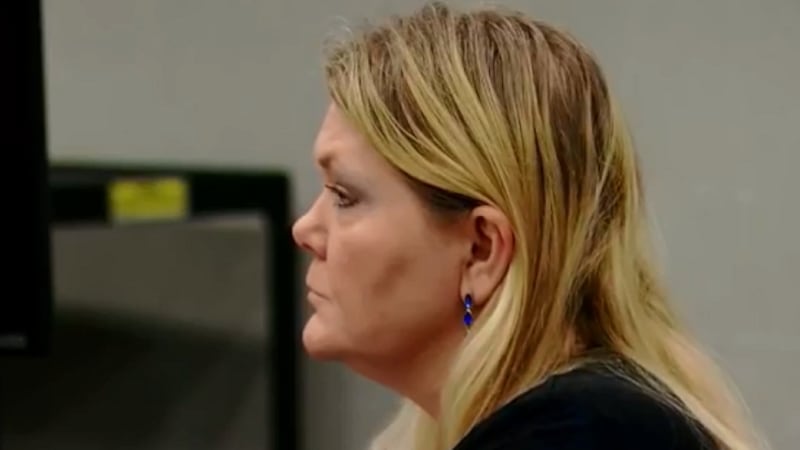 Tammy Moorer sits at the defense table Wednesday and listens during witness testimony....