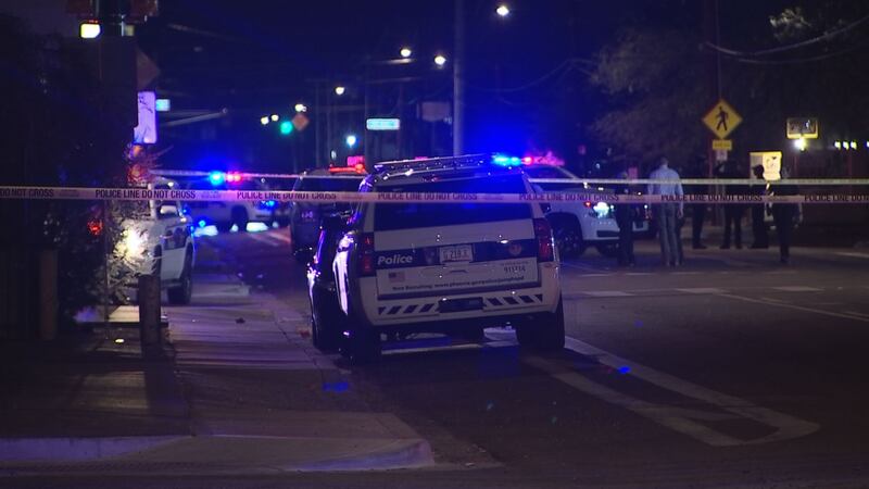 Crime scene taped off the area where a shooting took place in Phoenix. Police said nine people...