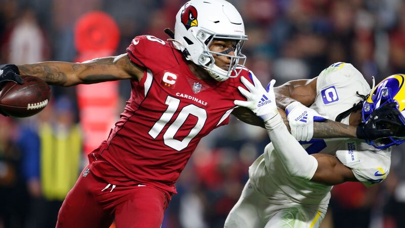Arizona Cardinals wide receiver DeAndre Hopkins (10) gives Los Angeles Rams safety Jordan...