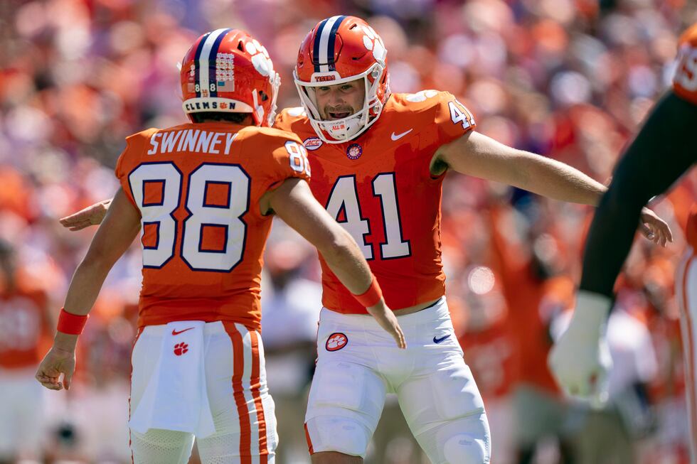 Clemson place kicker Jonathan Weitz (41) celebrates with wide receiver Clay Swinney (88) after...