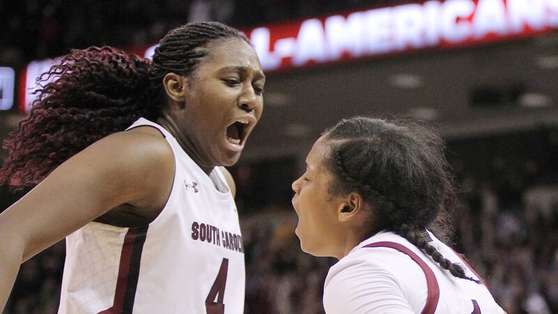 South Carolina forward Aliyah Boston (4) congratulates guard Zia Cooke (1) after Cooke stole...